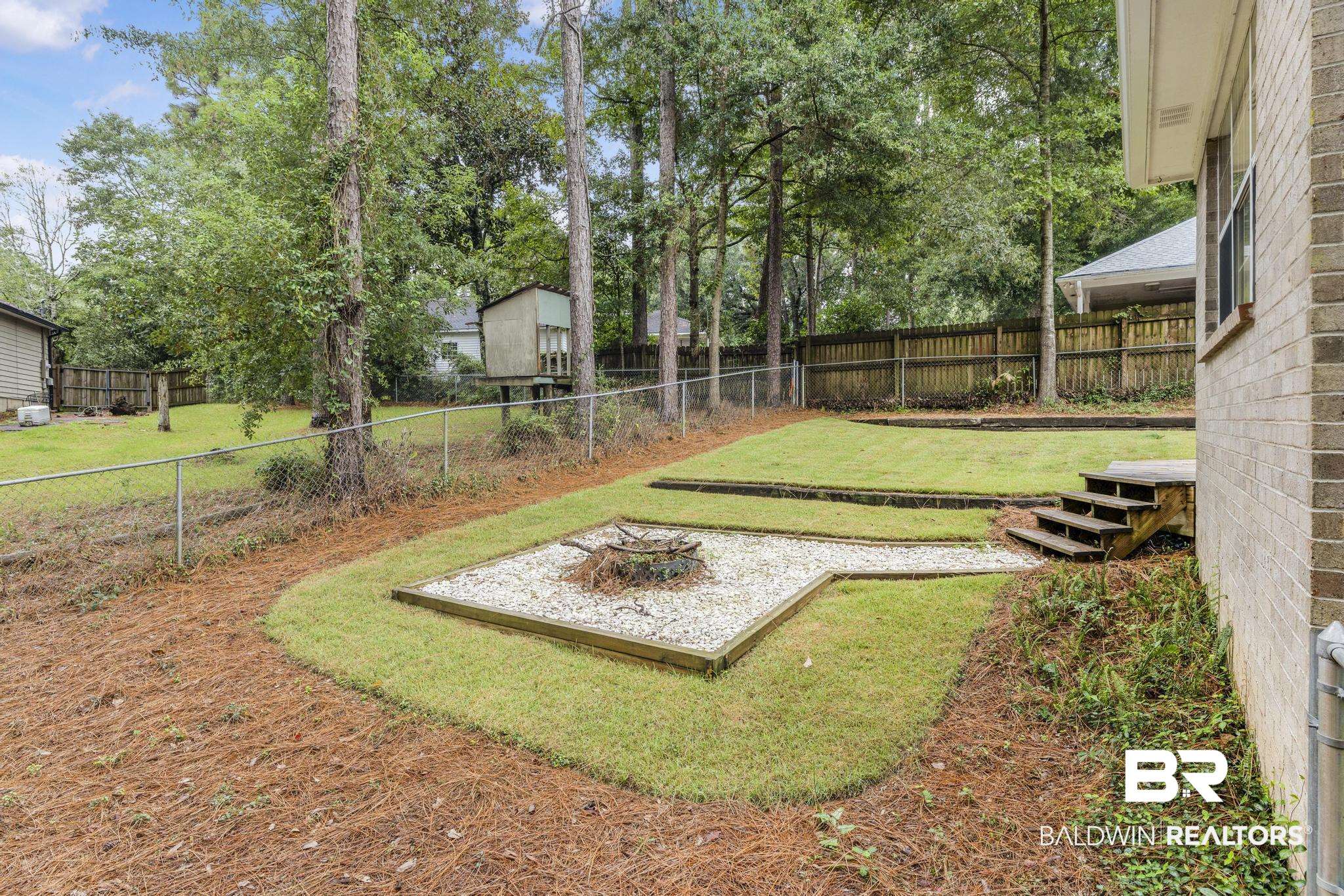 140 Hope Drive Daphne, AL 36526 - Photo 42 of 54 Fenced backyard with view of wooded area