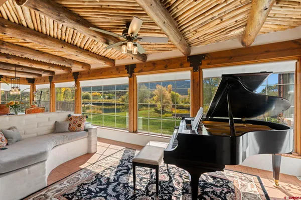 a dining room with furniture and window