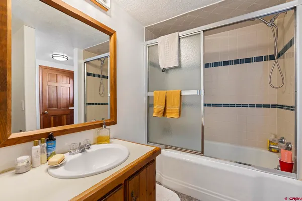 a bathroom with a toilet sink and tub