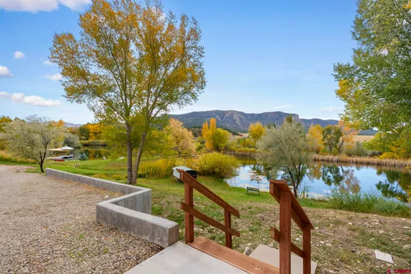 a view of a lake from a balcony