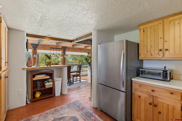 a kitchen with stainless steel appliances a refrigerator sink and cabinets
