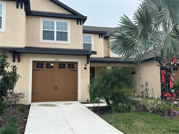 a front view of house and yard with green space