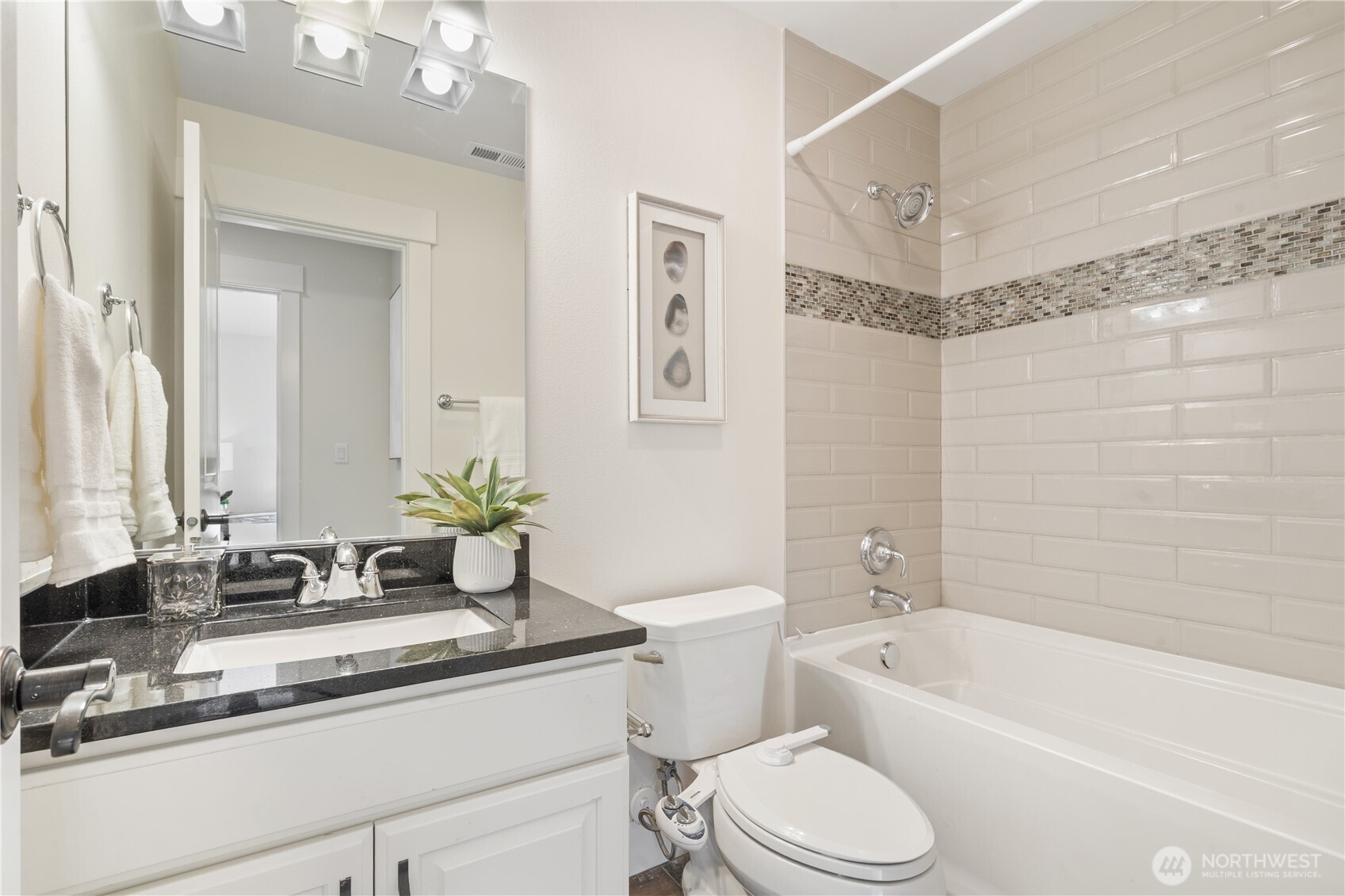 4524 186th Place Southeast, Unit B Bothell, WA 98012 - Photo 28 of 31 a bathroom with a granite countertop sink mirror toilet and bathtub