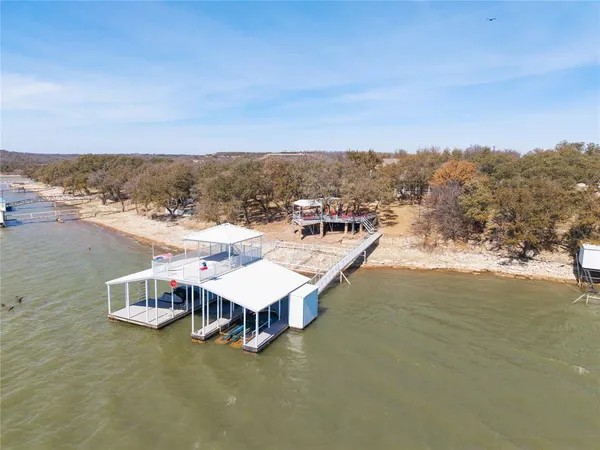 a view of a terrace with a table and chairs
