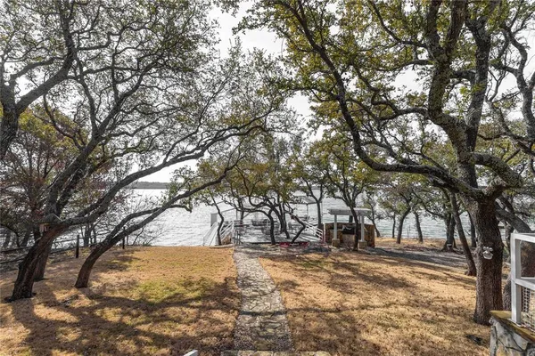 a view of a chairs and table in the patio