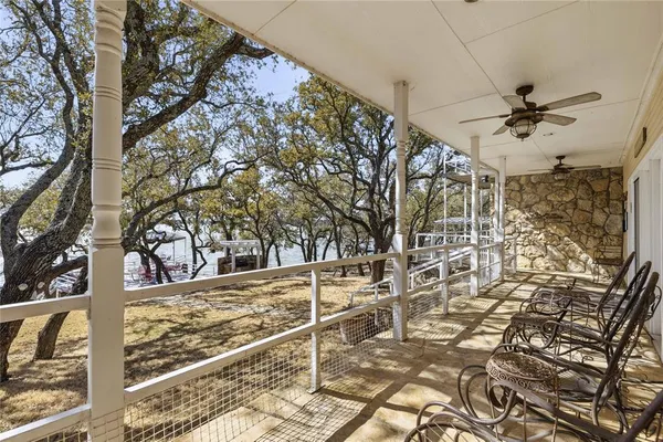 a living room with furniture a fireplace and a chandelier