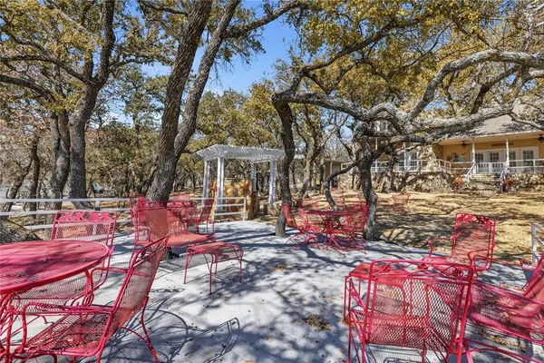 a view of a dining room with furniture and a chandelier