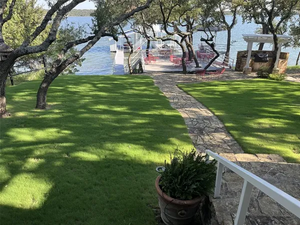 a backyard of a house with lots of green space