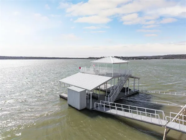 a view of a swimming pool with a table and chairs