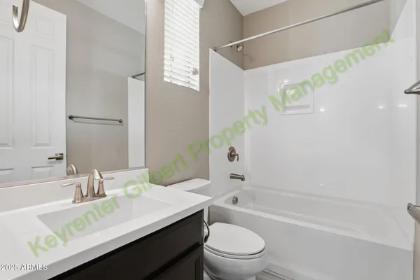 a kitchen with kitchen island granite countertop a sink a counter top space and living room view