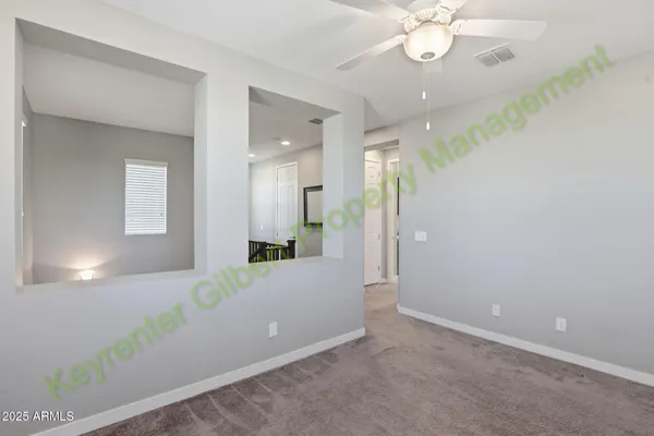 a bathroom with a granite countertop sink a toilet a mirror and shower