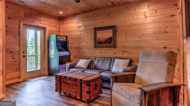 a living room with furniture and a flat screen tv