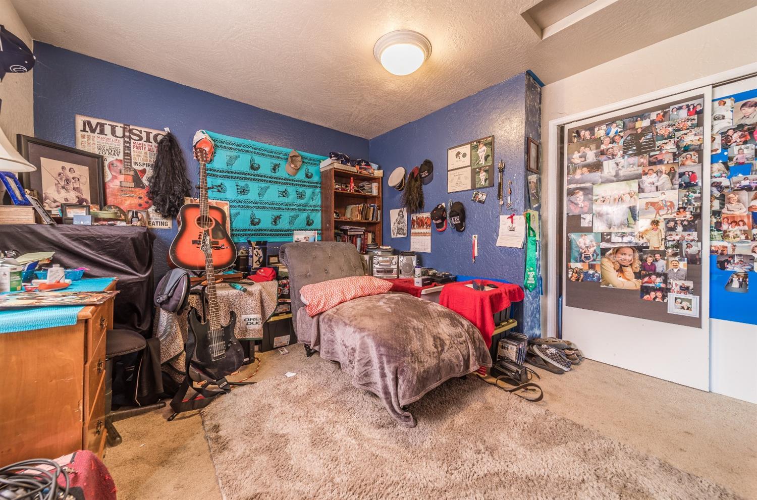 728 West Valley View Road Ashland, OR 97520 - Photo 13 of 32 a bed room with a bed and a large window