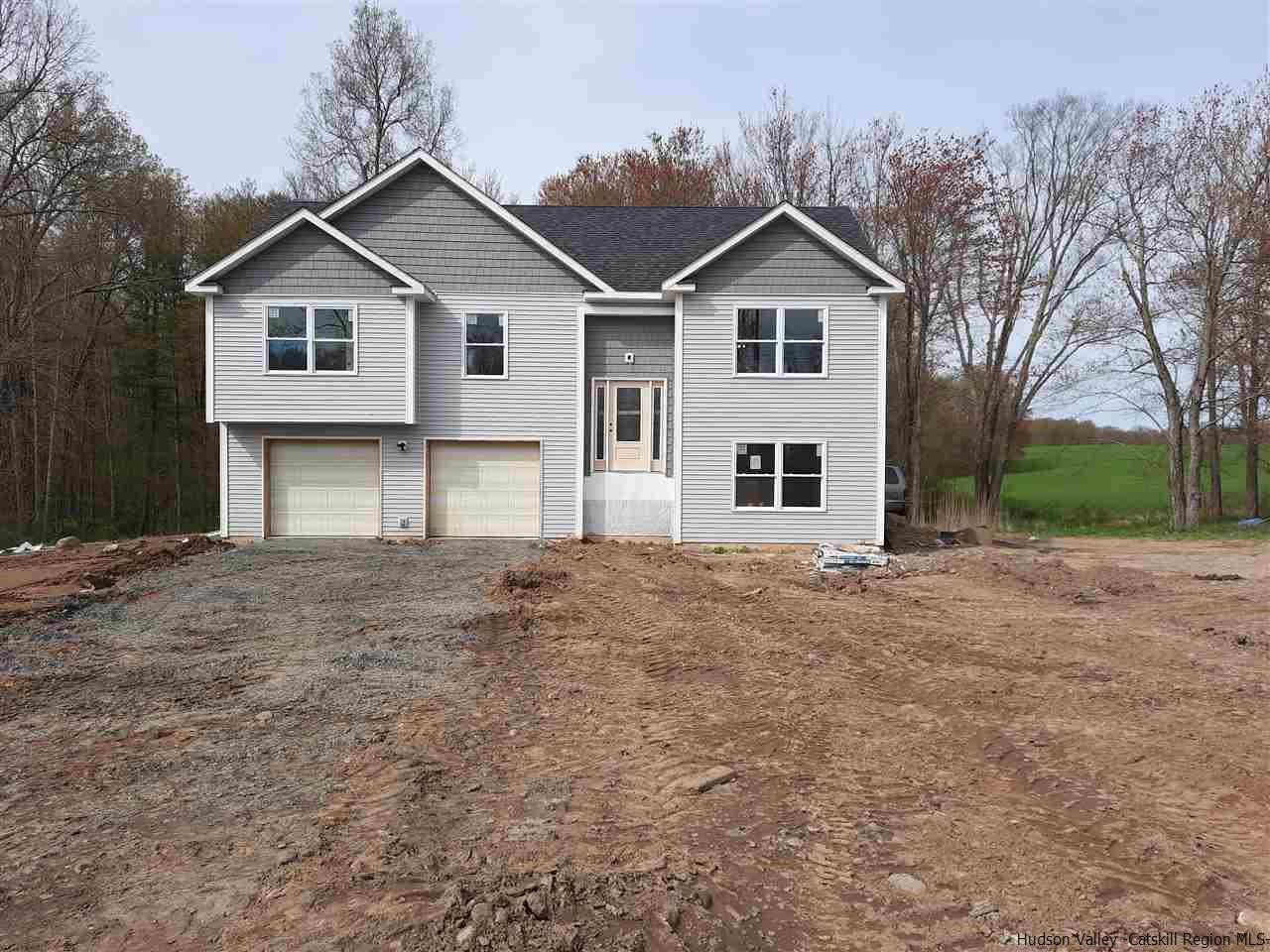a view of a yard in front of a house with a yard