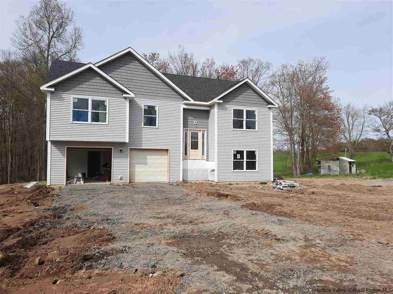858 Wallkill Avenue Wallkill, NY 12589 - Photo 8 of 9 a front view of a house with a yard