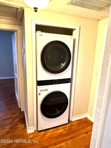 a view of a hallway with washer and dryer