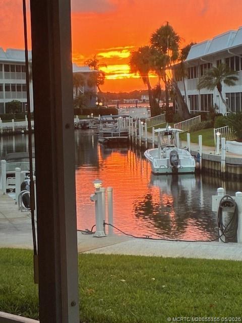 1862 Southwest Palm City Road, Unit 103 Stuart, FL 34994 - Photo 27 of 28 a view of a lake with a house