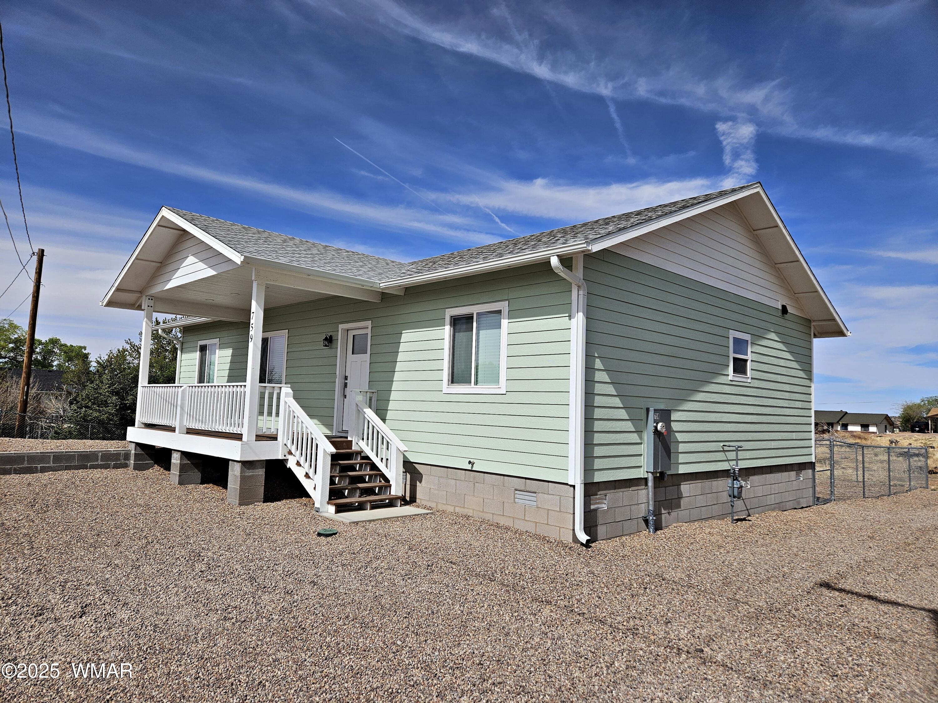 759 South 5th W Street Snowflake, AZ 85937 - Photo 1 of 18 a front view of a house with a yard