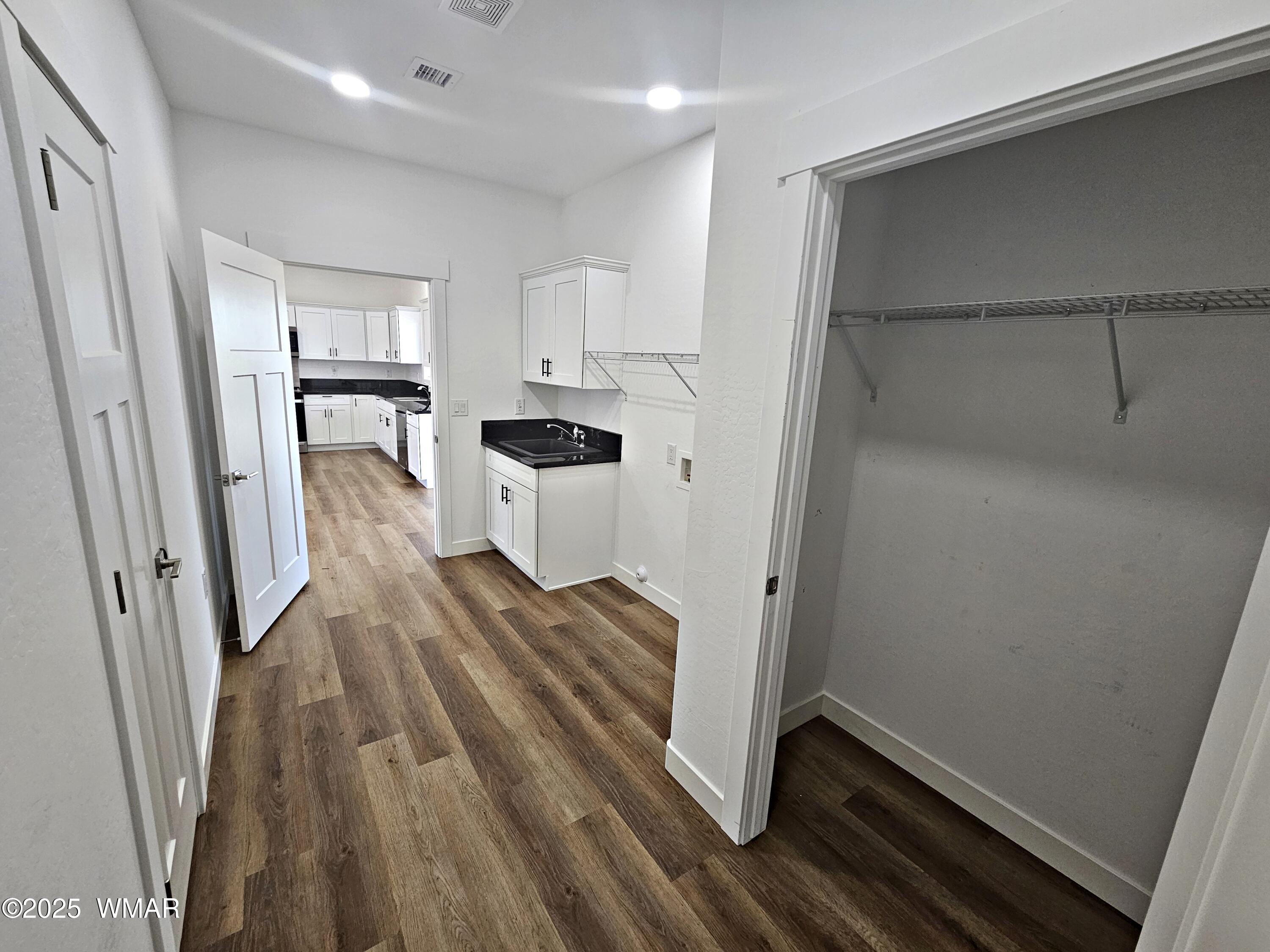 759 South 5th W Street Snowflake, AZ 85937 - Photo 12 of 18 a view of kitchen with furniture and wooden floor