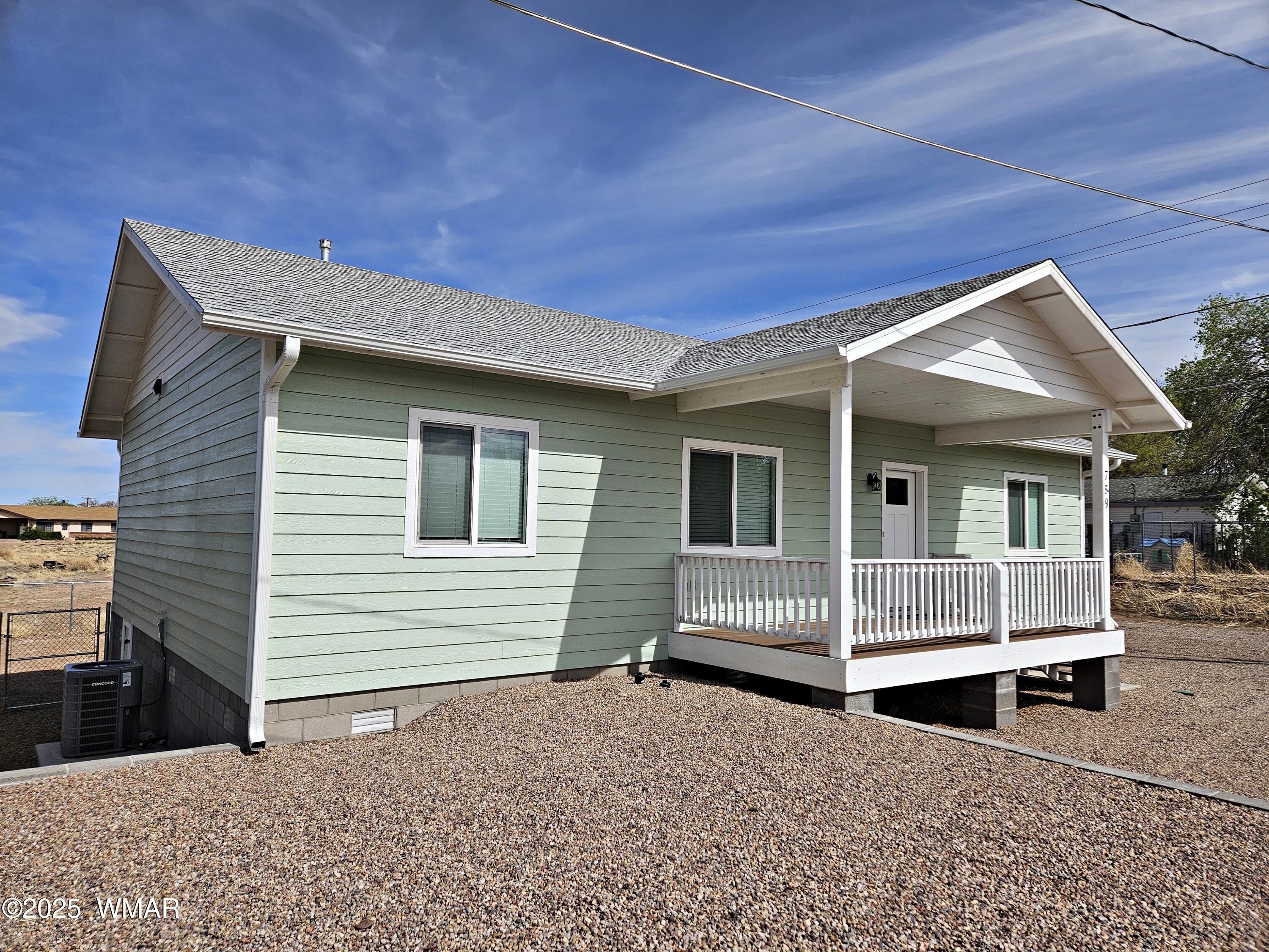 759 South 5th W Street Snowflake, AZ 85937 - Photo 2 of 18 a front view of a house with wooden fence