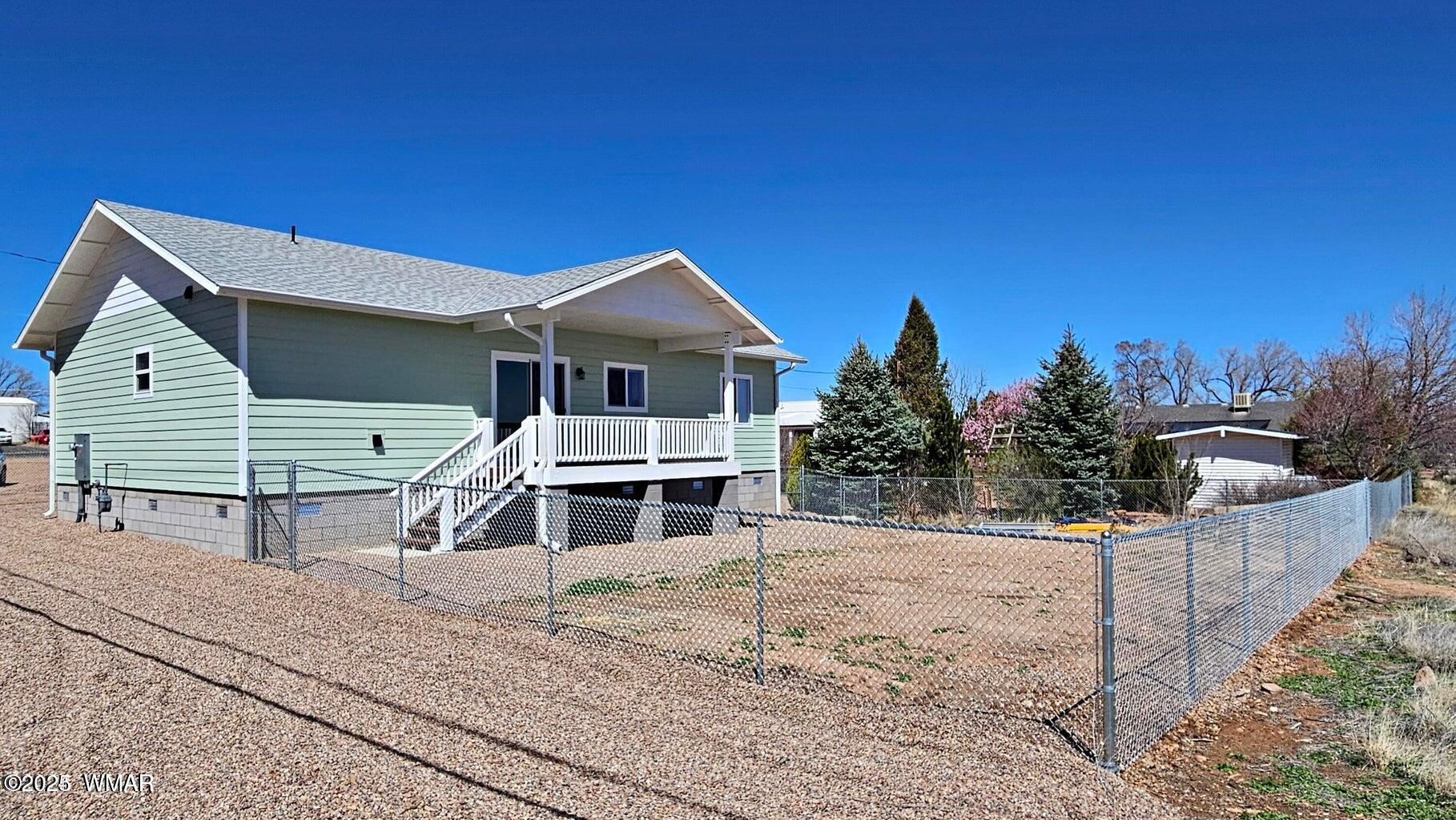 759 South 5th W Street Snowflake, AZ 85937 - Photo 4 of 18 a view of a house with a yard