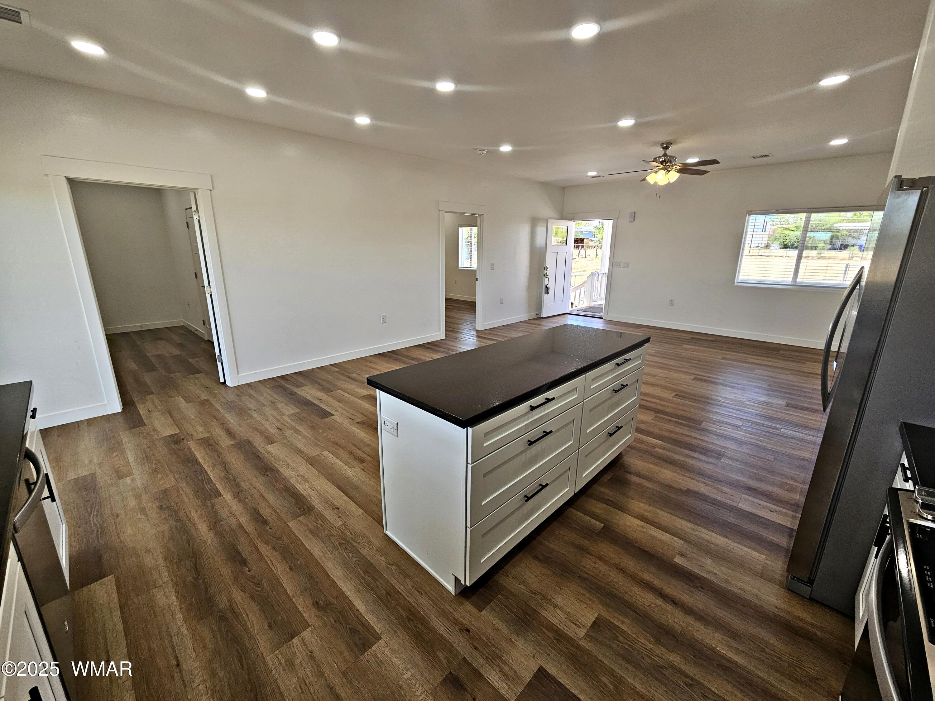 759 South 5th W Street Snowflake, AZ 85937 - Photo 9 of 18 a kitchen with sink window and wooden floor