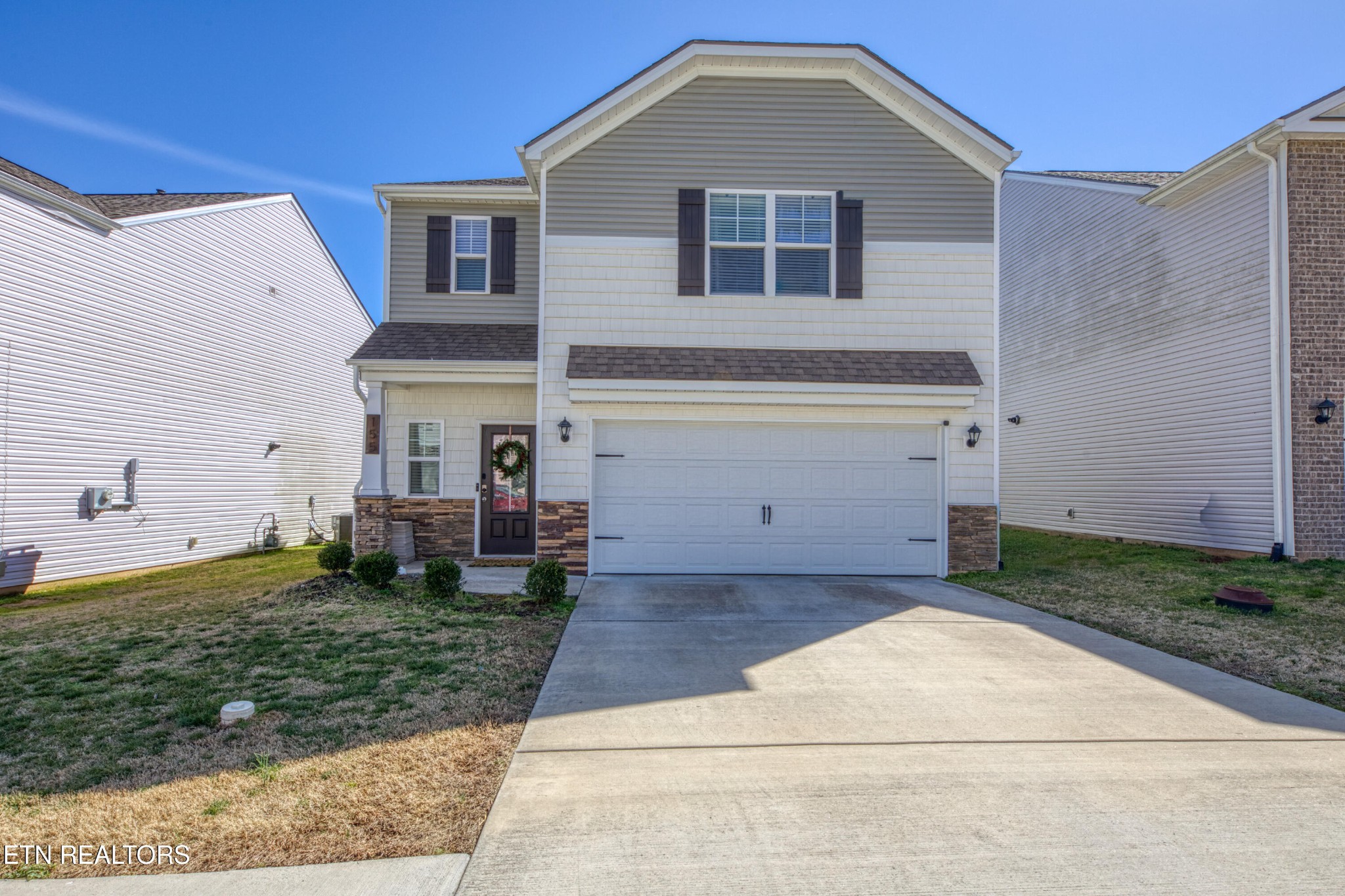 a front view of a house with a yard
