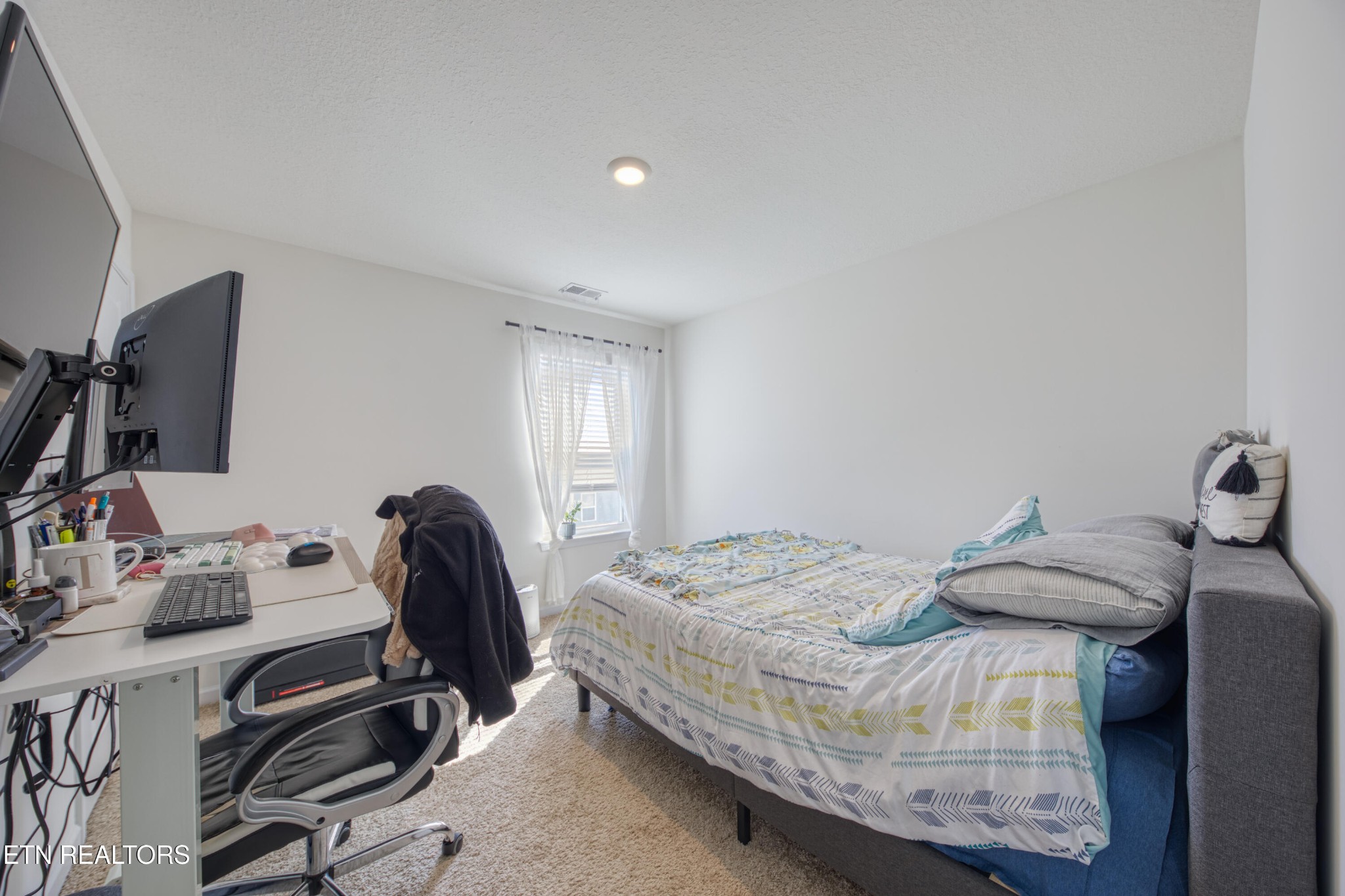 155 Ibis Loop Oak Ridge, TN 37830 - Photo 17 of 20 a bedroom with a bed and a desk