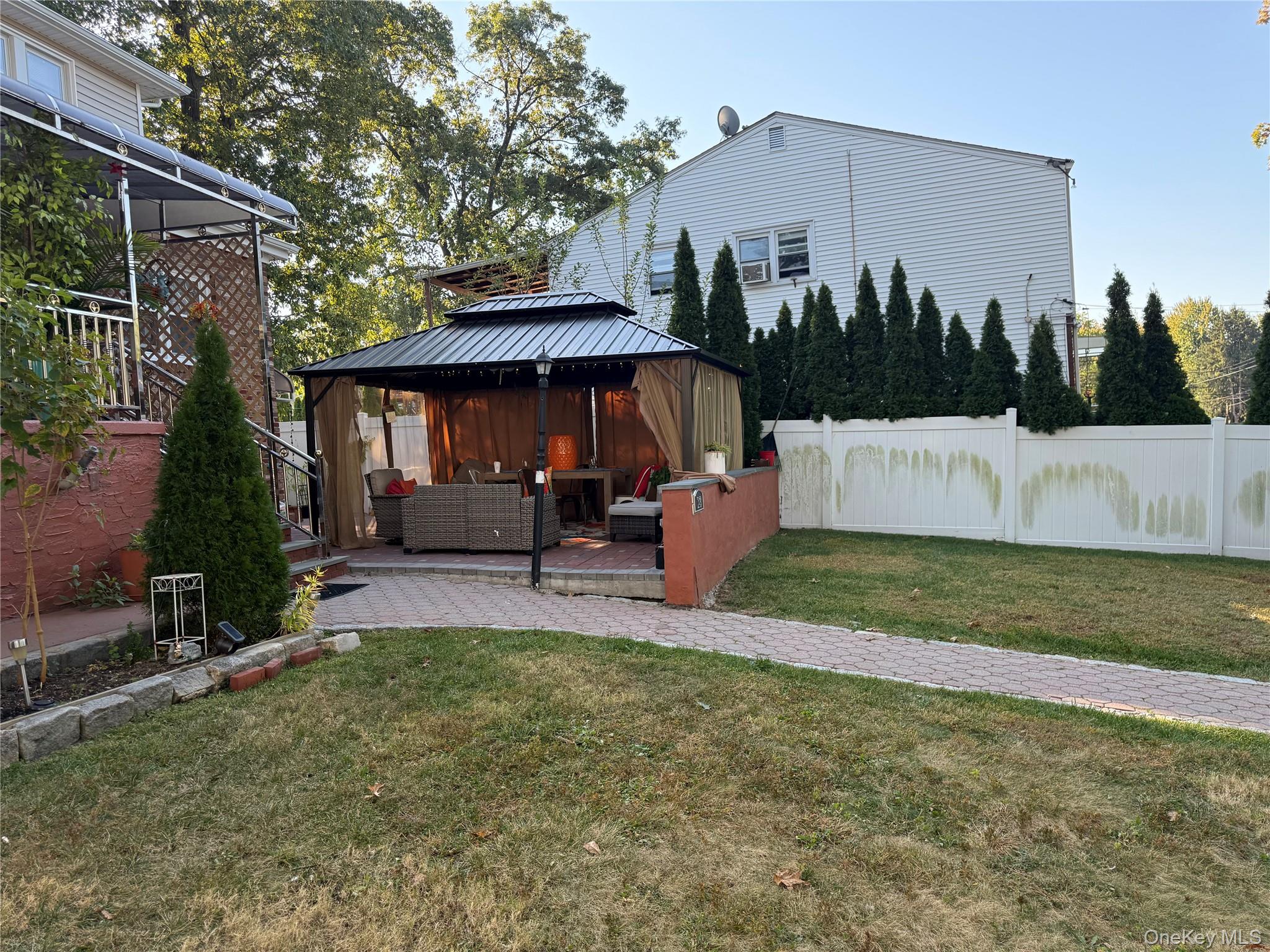 Undisclosed Address Bronxville, NY 10708 - Photo 5 of 7 a view of a house with backyard and sitting area