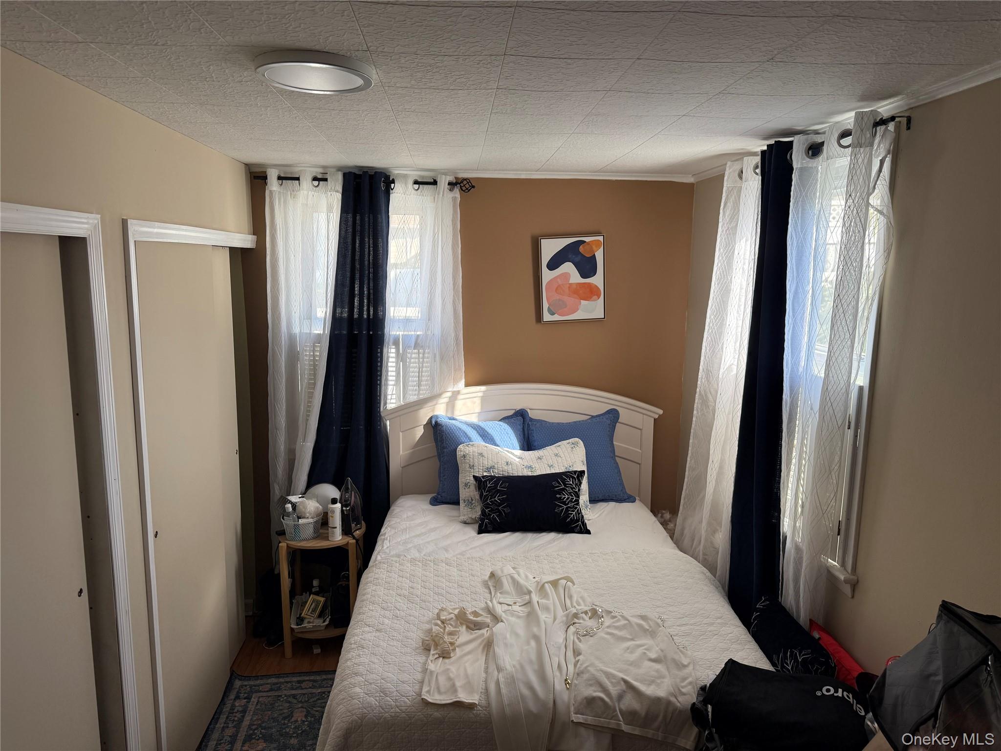 Undisclosed Address Bronxville, NY 10708 - Photo 7 of 7 a bedroom with a bed and wooden floor