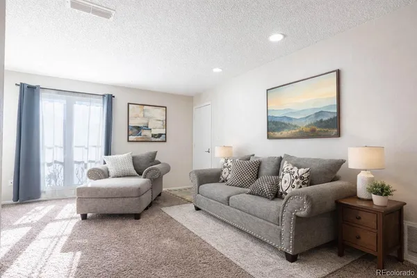 a living room with furniture and a couch