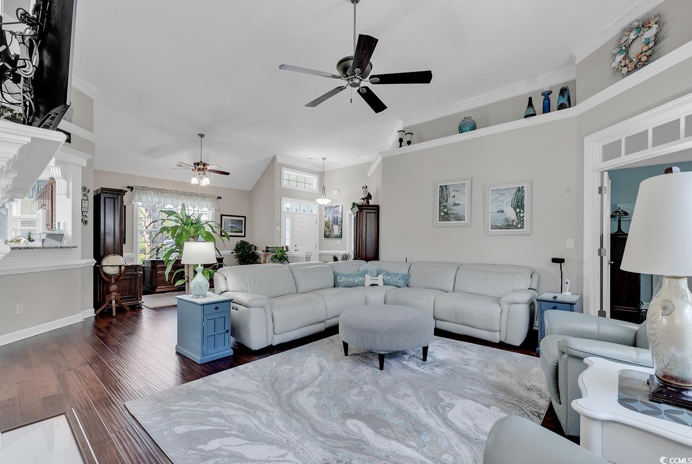 517 Stone Crest Court Murrells Inlet, SC 29576 - Photo 13 of 39 Living room with crown molding, ceiling fan, and d