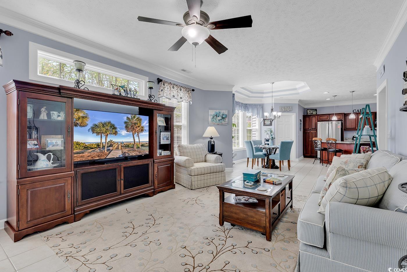 517 Stone Crest Court Murrells Inlet, SC 29576 - Photo 14 of 39 Tiled living room with ceiling fan with notable ch
