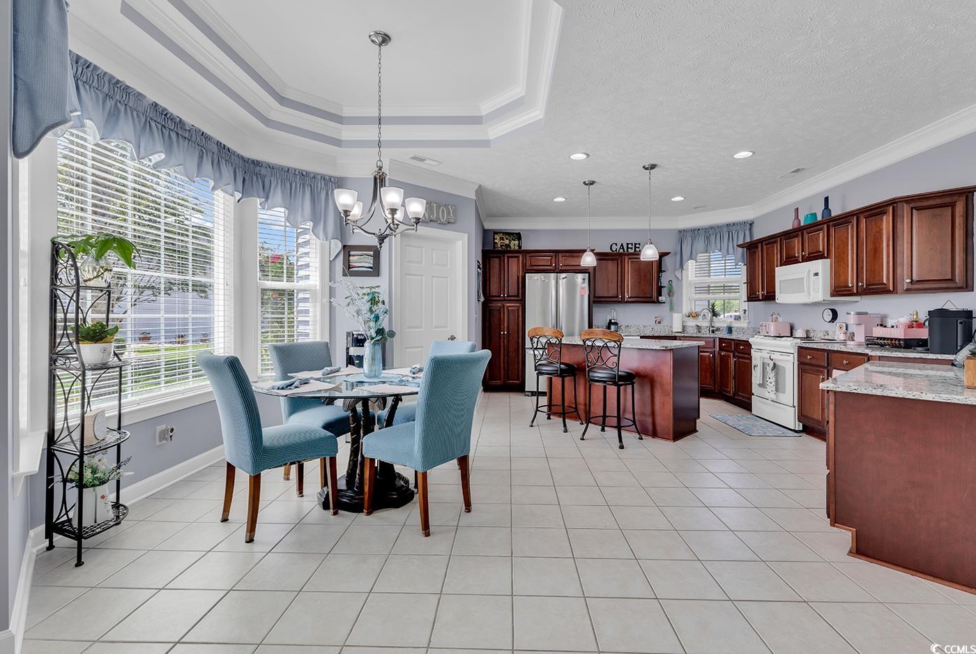 517 Stone Crest Court Murrells Inlet, SC 29576 - Photo 15 of 39 Dining area with a chandelier, ornamental molding,
