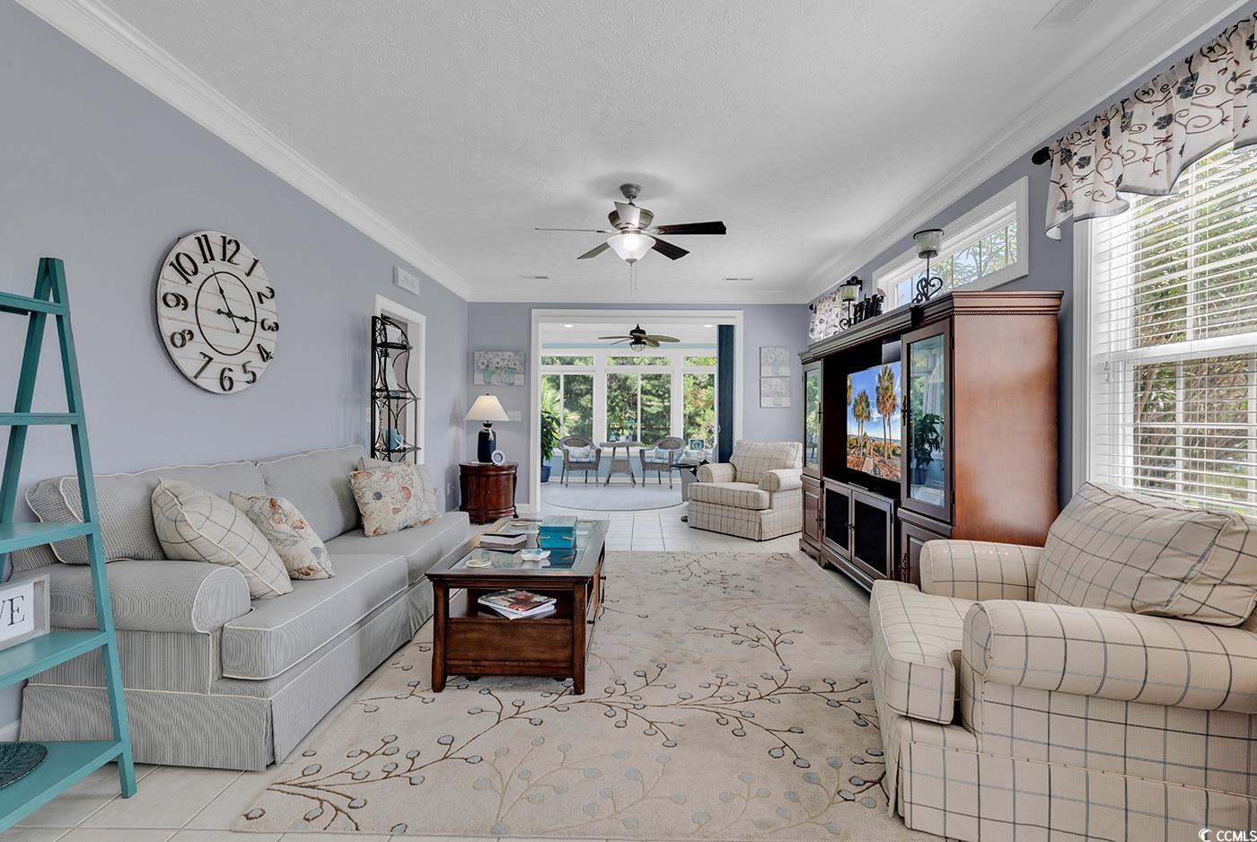 517 Stone Crest Court Murrells Inlet, SC 29576 - Photo 16 of 39 Living room with ceiling fan, light tile patterned