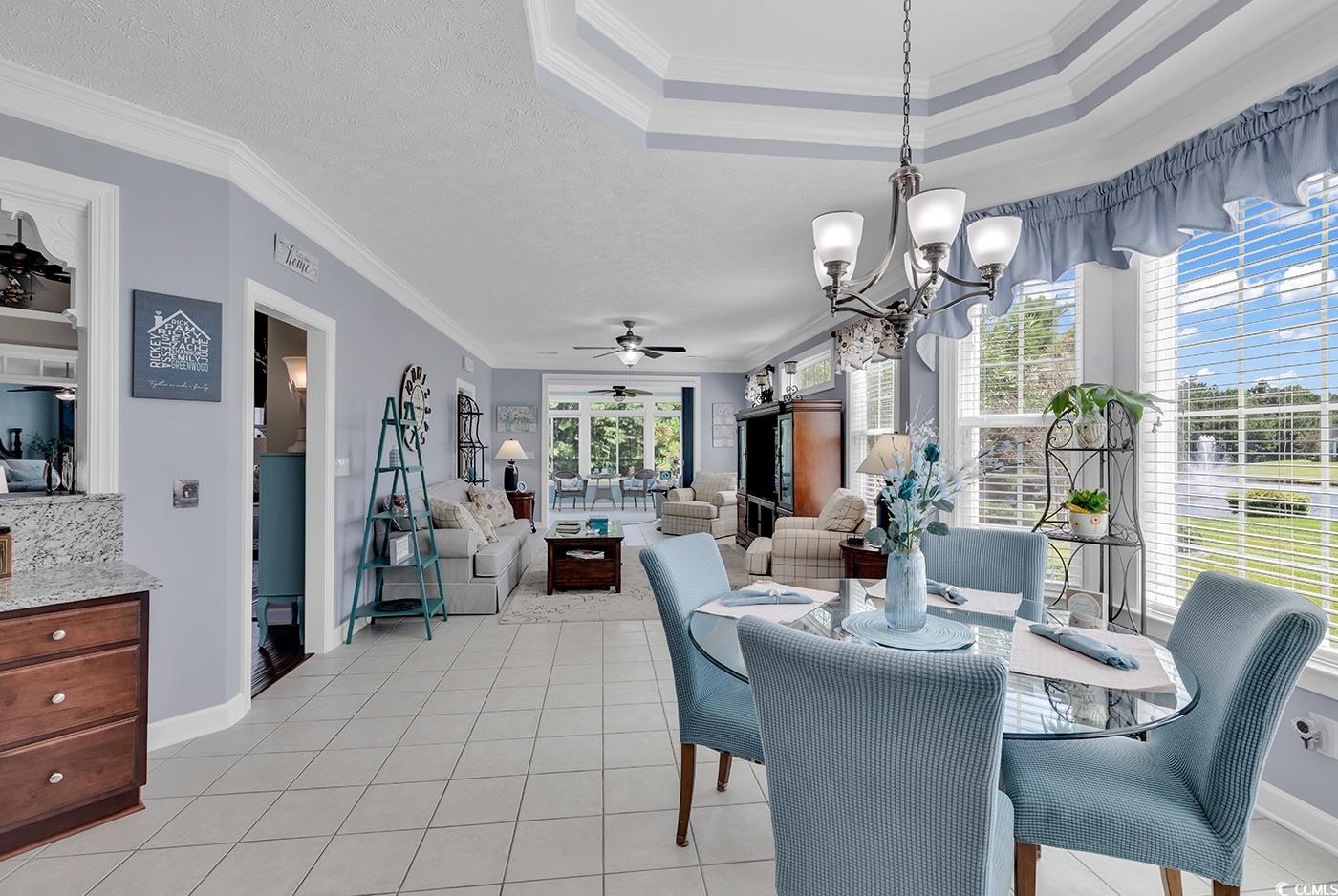 517 Stone Crest Court Murrells Inlet, SC 29576 - Photo 20 of 39 Tiled dining room featuring a textured ceiling, ce