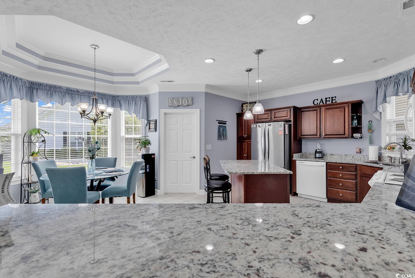 517 Stone Crest Court Murrells Inlet, SC 29576 - Photo 21 of 39 Kitchen featuring a kitchen island, crown molding,