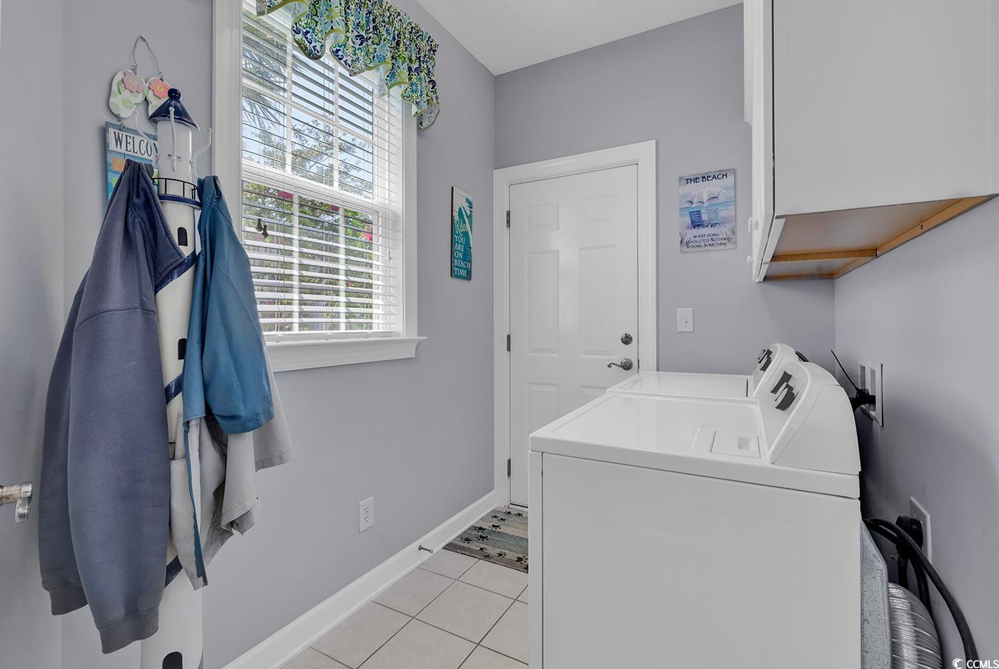 517 Stone Crest Court Murrells Inlet, SC 29576 - Photo 25 of 39 Washroom featuring cabinets, light tile patterned