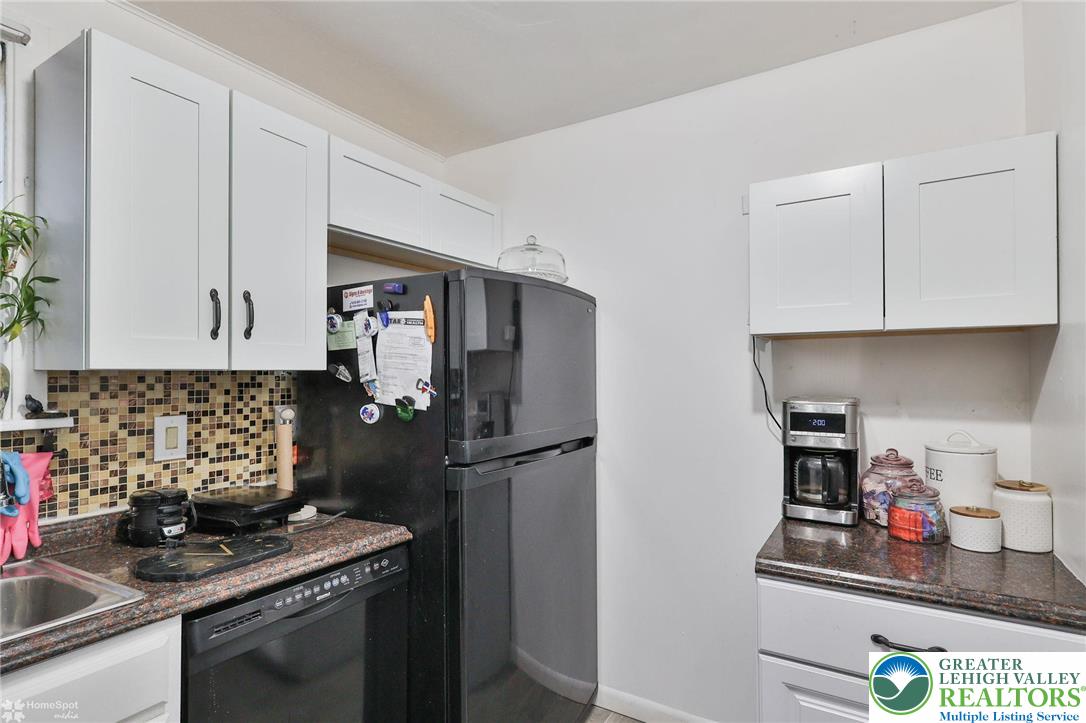 1147 Arcadia Street Bethlehem, PA 18018 - Photo 22 of 66 a kitchen with stainless steel appliances granite countertop a refrigerator sink and cabinets