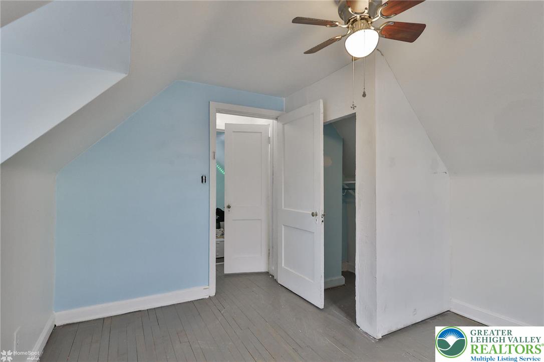 1147 Arcadia Street Bethlehem, PA 18018 - Photo 35 of 66 an empty room with a bathroom and a chandelier fan