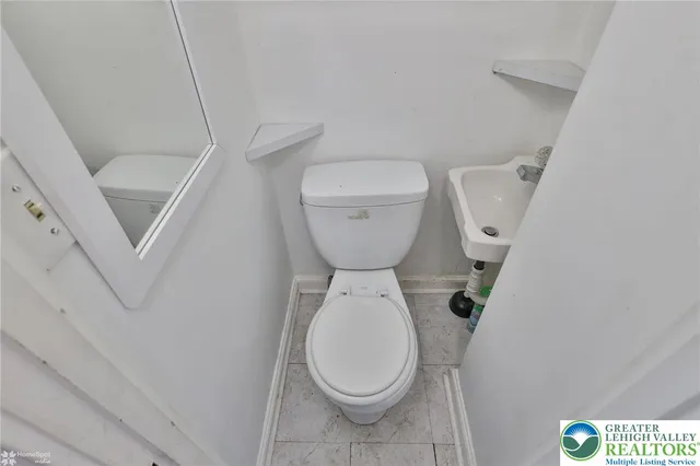 a bedroom with a bed and a television