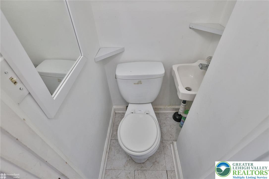 1147 Arcadia Street Bethlehem, PA 18018 - Photo 36 of 66 a close view of a toilet and a sink