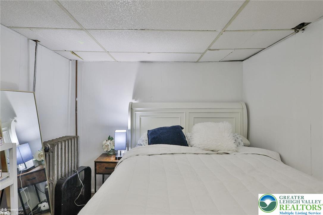 1147 Arcadia Street Bethlehem, PA 18018 - Photo 39 of 66 a bedroom with a bed and a lamp