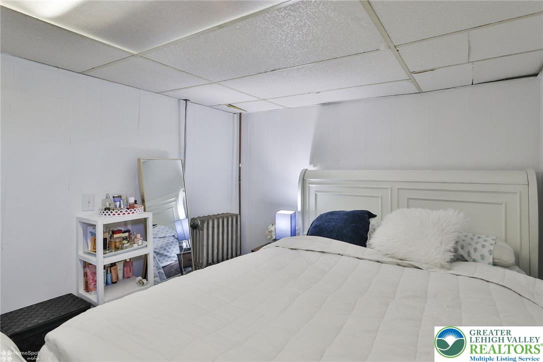 1147 Arcadia Street Bethlehem, PA 18018 - Photo 40 of 66 a bedroom with a bed and a book shelf