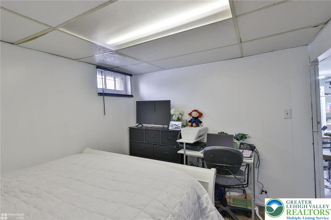 1147 Arcadia Street Bethlehem, PA 18018 - Photo 41 of 66 a bedroom with a bed and wooden floor