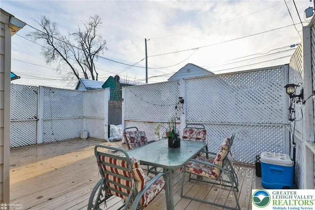 a view of a house with a snow in the yard