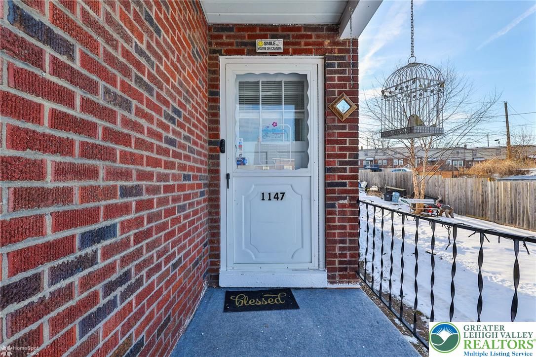 1147 Arcadia Street Bethlehem, PA 18018 - Photo 5 of 66 a view of a brick house with a large window
