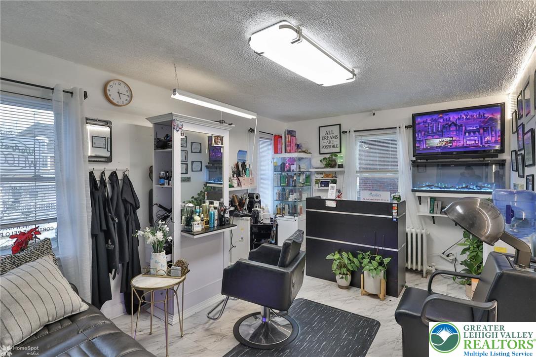 1147 Arcadia Street Bethlehem, PA 18018 - Photo 7 of 66 a living room with furniture and a flat screen tv