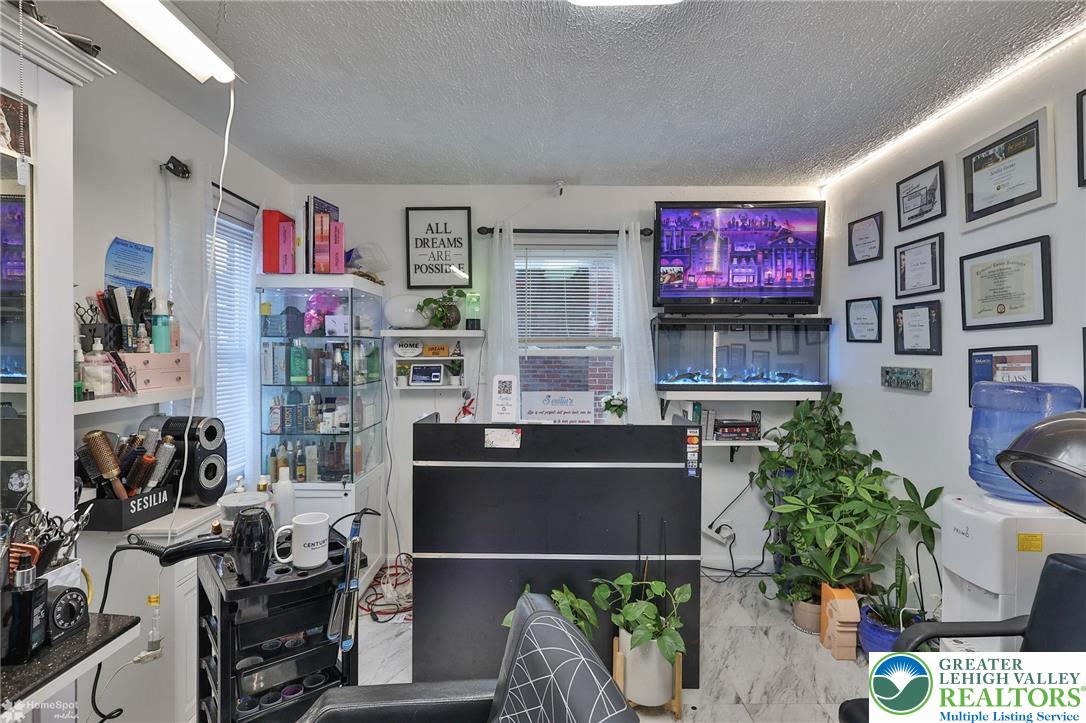 1147 Arcadia Street Bethlehem, PA 18018 - Photo 8 of 66 a living room with furniture and a flat screen tv