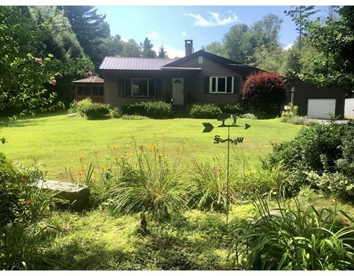 141 Center Road Gill, MA 01354 - Photo 1 of 37 a view of a garden with a house in the background